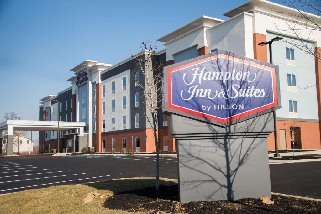 a sign for a hampton inn and suites at Hampton Inn & Suites Warrington Horsham in Warrington