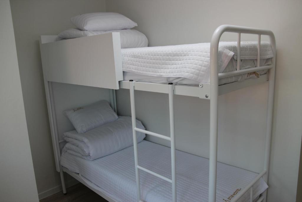 Postel nebo postele na pokoji v ubytování Starhostel Dongdaemun Suite