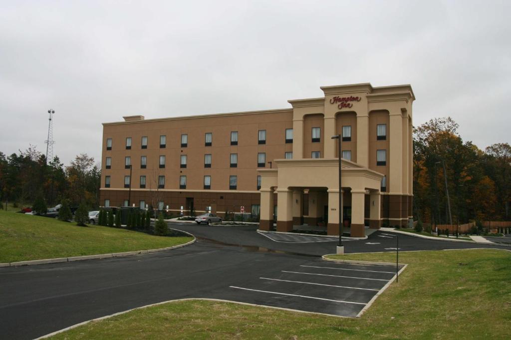 a large building with a road in front of it at Hampton Inn Turnersville in Blackwood