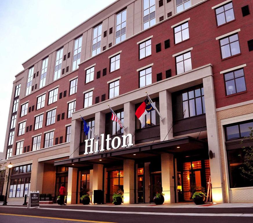 a hotel building with the hilton sign on it at Hilton Asheville Biltmore Park in Asheville