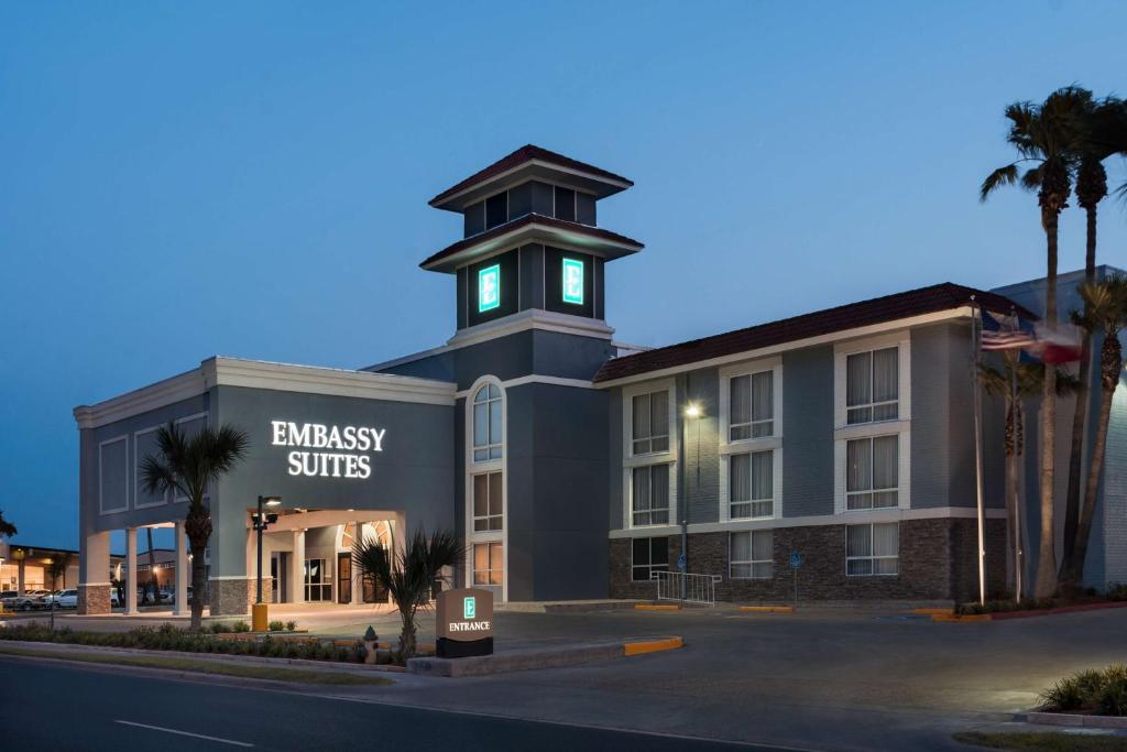 a building with a clock tower on top of it at Embassy Suites Corpus Christi in Corpus Christi