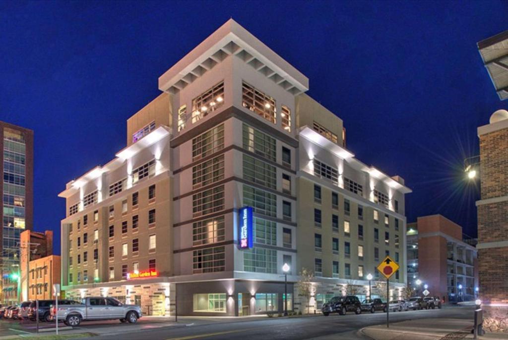 a tall building with a sign on the side of it at Hilton Garden Inn Little Rock Downtown in Little Rock