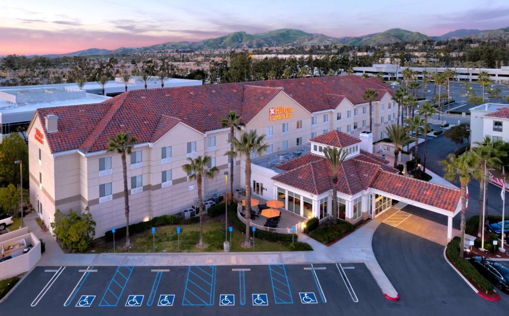 an aerial view of a hotel with palm trees at Hilton Garden Inn Irvine East/Lake Forest in Foothill Ranch