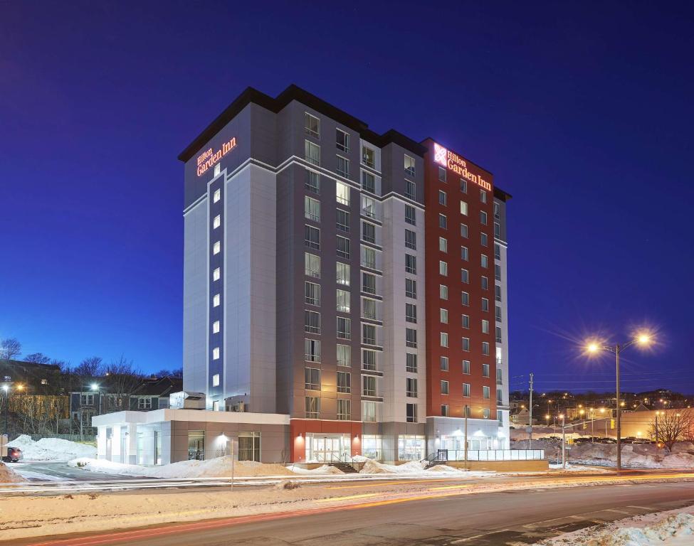 a large hotel building at night in the snow at Hilton Garden Inn St. John's Newfoundland, Canada in St. John's