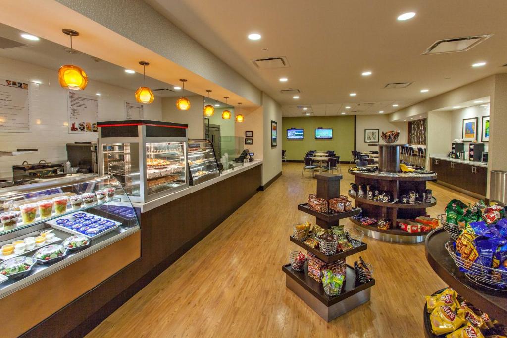 a store with a bakery with cakes and pastries at DoubleTree by Hilton Pittsburgh-Green Tree in Pittsburgh