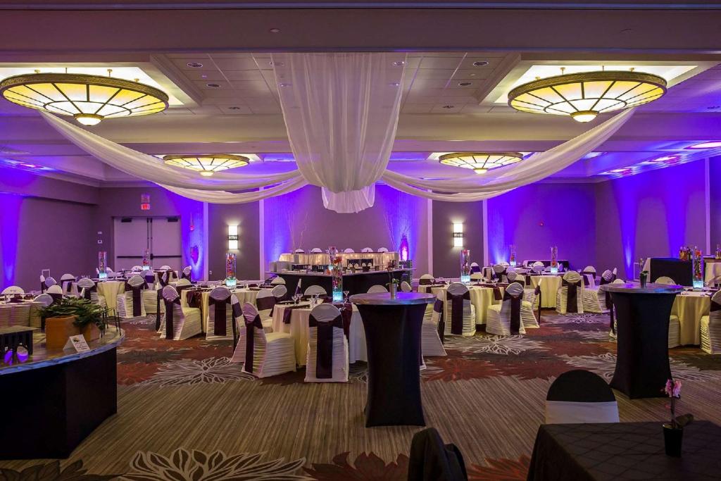 a banquet hall with white tables and purple at DoubleTree by Hilton Pittsburgh-Green Tree in Pittsburgh