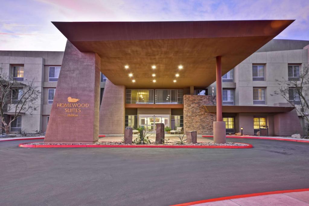 a building with a sign that reads innovation shuttle at Homewood Suites by Hilton Palm Desert in Palm Desert