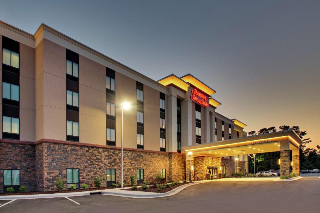 a rendering of a hotel with a parking lot at Hampton Inn & Suites By Hilton Southport in Southport