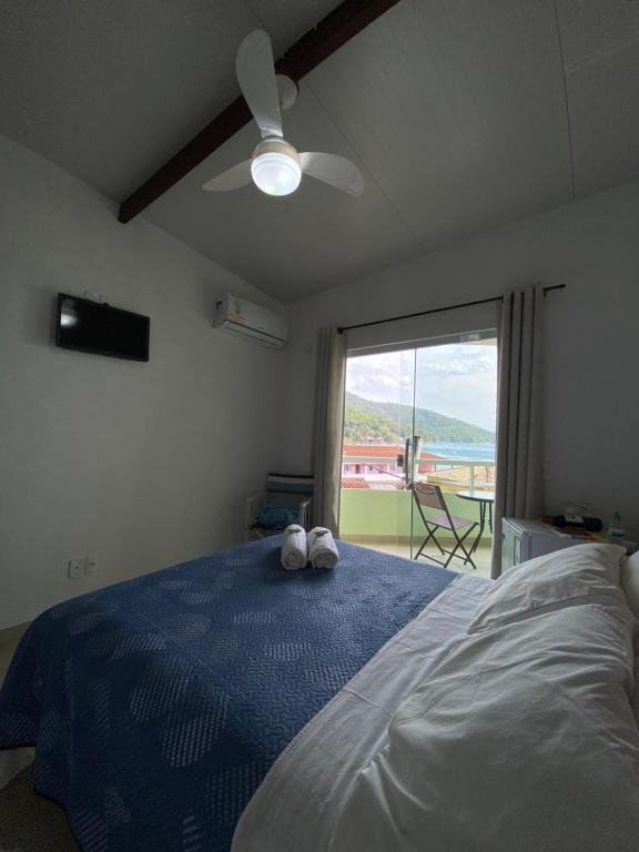Postel nebo postele na pokoji v ubytování Casa Caiçara