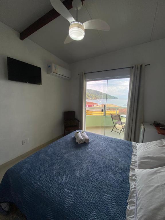 Postel nebo postele na pokoji v ubytování Casa Caiçara
