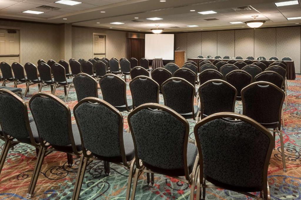 a room with rows of chairs in a conference room at Hampton Inn Council Bluffs in Council Bluffs