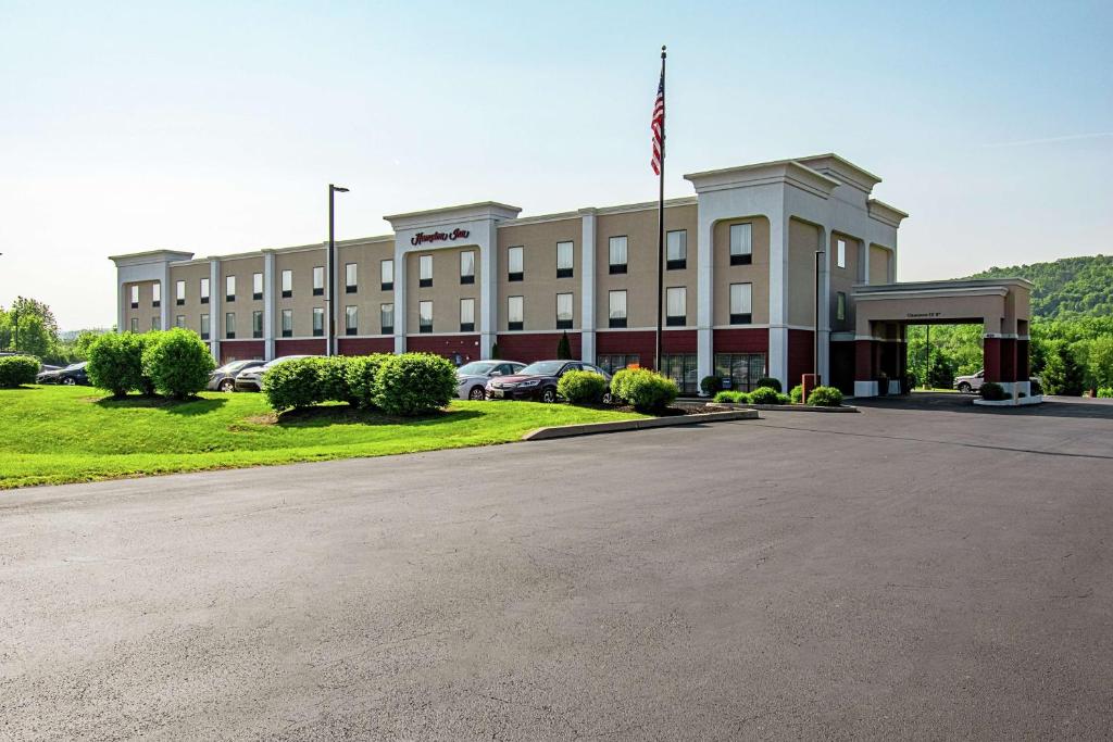 a large building with a parking lot in front of it at Hampton Inn Pine Grove in Pine Grove