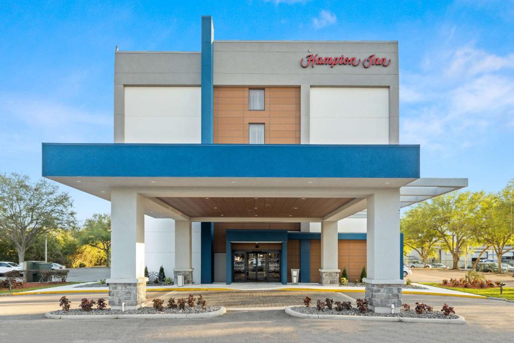 a group of people sitting outside of a building at Hampton Inn Tampa-Veterans Expressway in Tampa