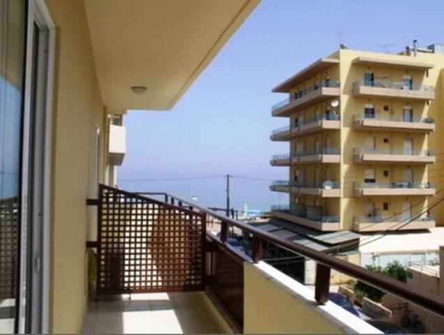 a balcony with a view of a apartment building at Evagellina Studios in Rethymno
