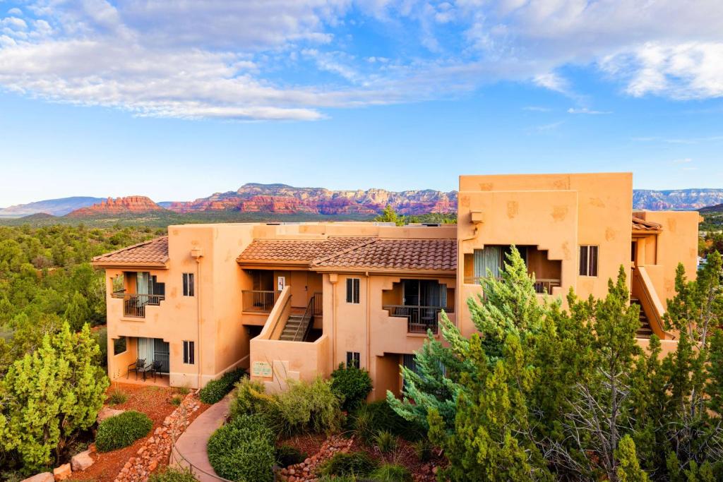 an apartment building with a view of the mountains at Hilton Vacation Club Sedona Summit in Sedona