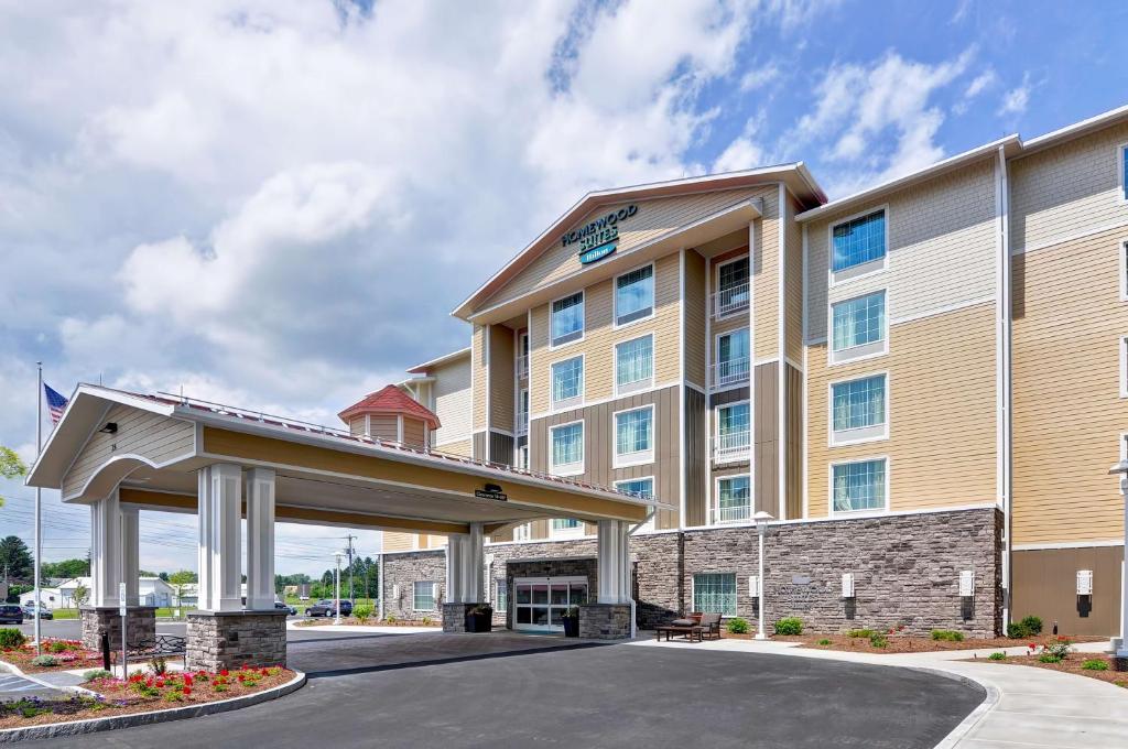 a rendering of a hotel with a gated entrance at Homewood Suites By Hilton Schenectady in Schenectady