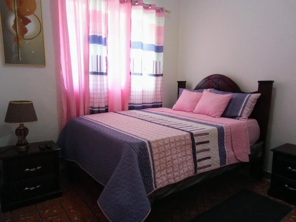 Postel nebo postele na pokoji v ubytování Hostal María Fernanda