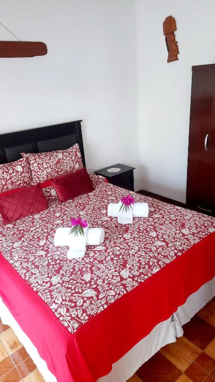 Postel nebo postele na pokoji v ubytování Hostal Makohe Rapa Nui