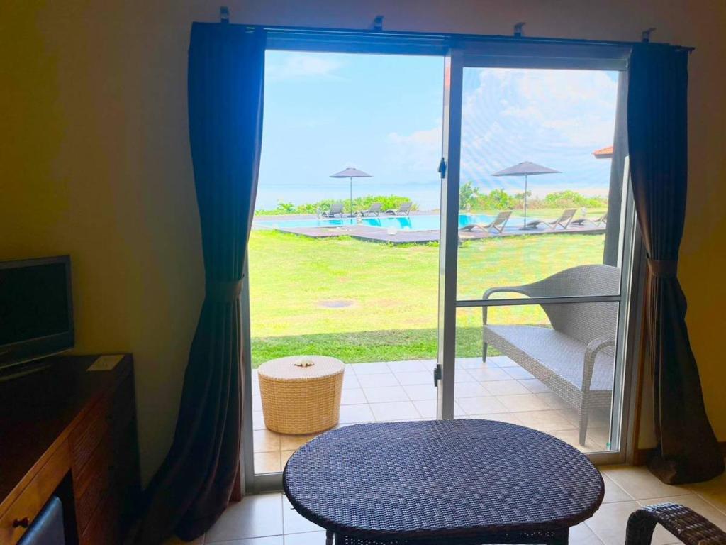 Posezení v ubytování エコヴィレッジ西表 Eco Village Iriomote