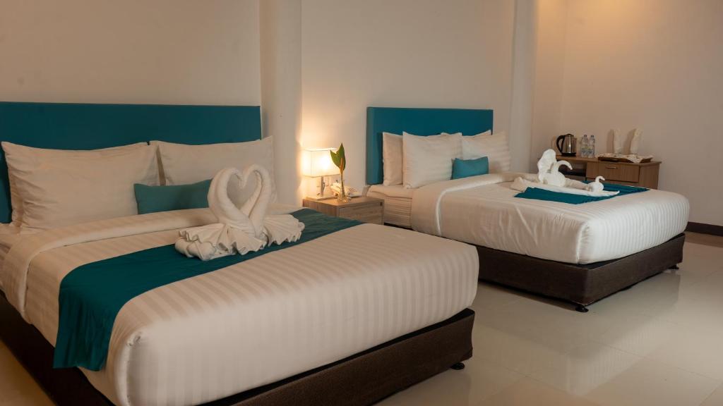 Postel nebo postele na pokoji v ubytování Boracay Sea View Hotel