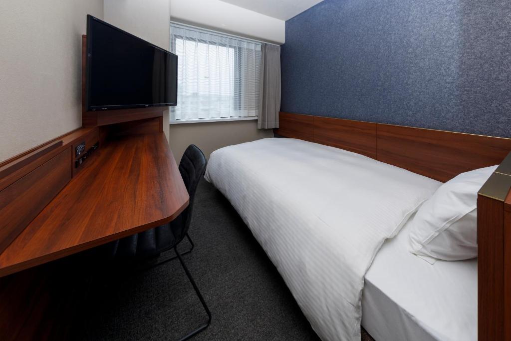 Postel nebo postele na pokoji v ubytování Via Inn Shimonoseki