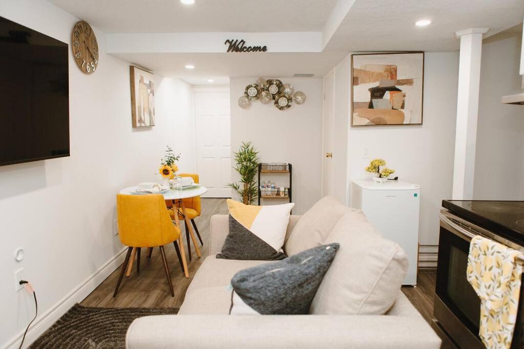 a living room with a couch and a table at Feeling Home, while away in Kitchener