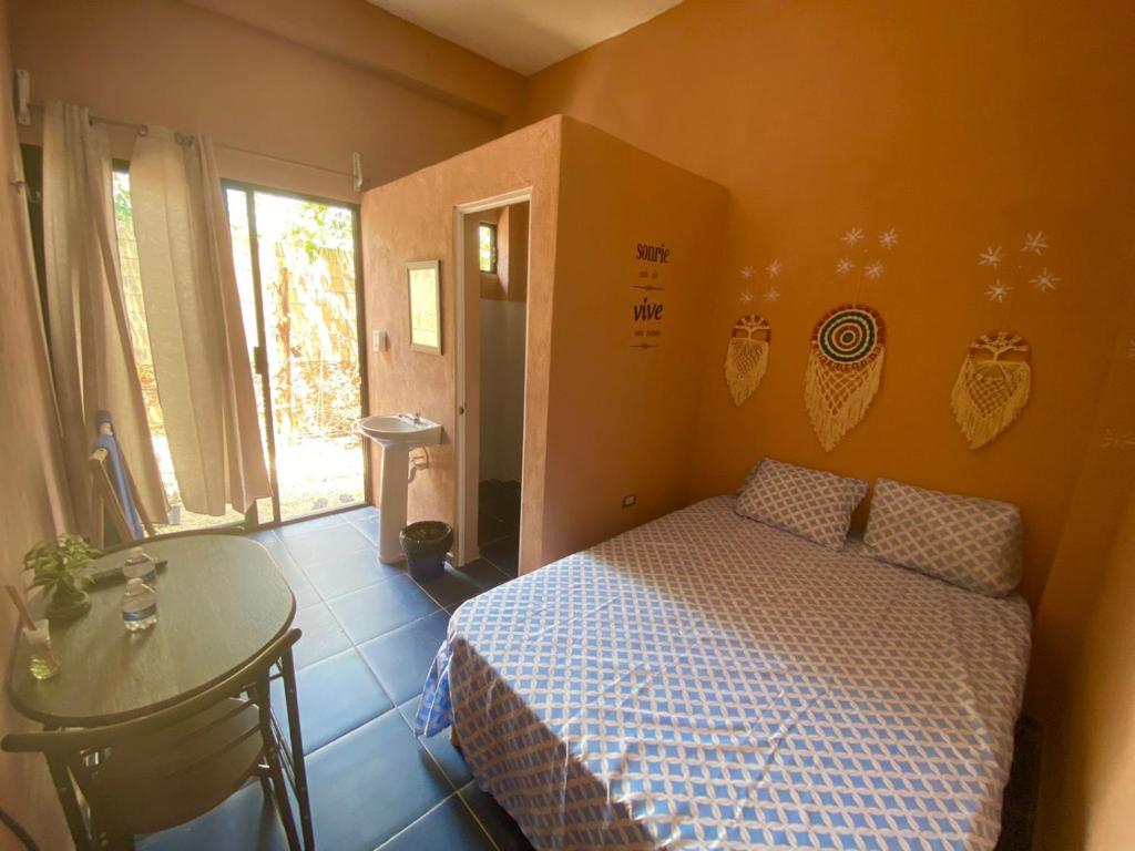 Postel nebo postele na pokoji v ubytování Casa Lol-cab Hostal