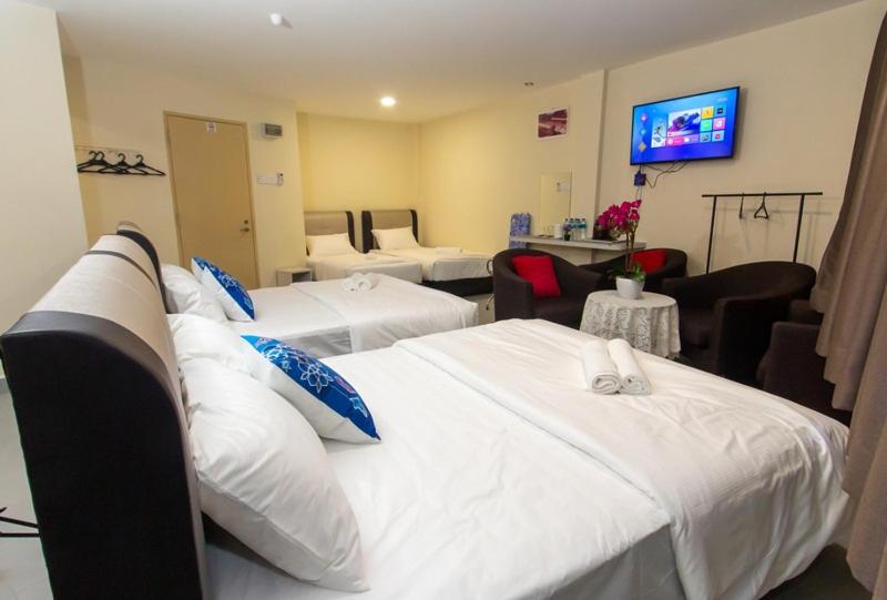 Postel nebo postele na pokoji v ubytování Southern Tip Hotel