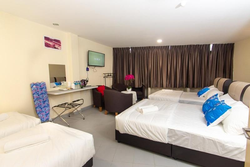 Postel nebo postele na pokoji v ubytování Southern Tip Hotel
