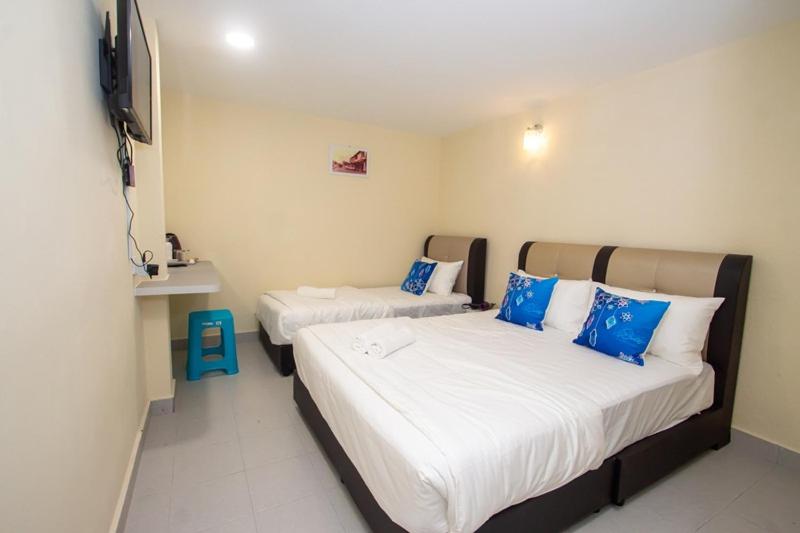 Postel nebo postele na pokoji v ubytování Southern Tip Hotel