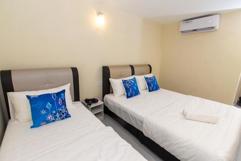 Postel nebo postele na pokoji v ubytování Southern Tip Hotel