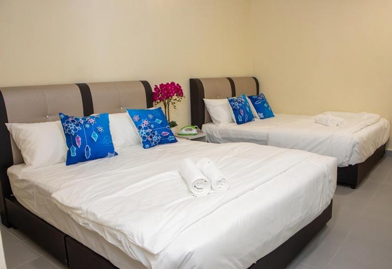 Postel nebo postele na pokoji v ubytování Southern Tip Hotel