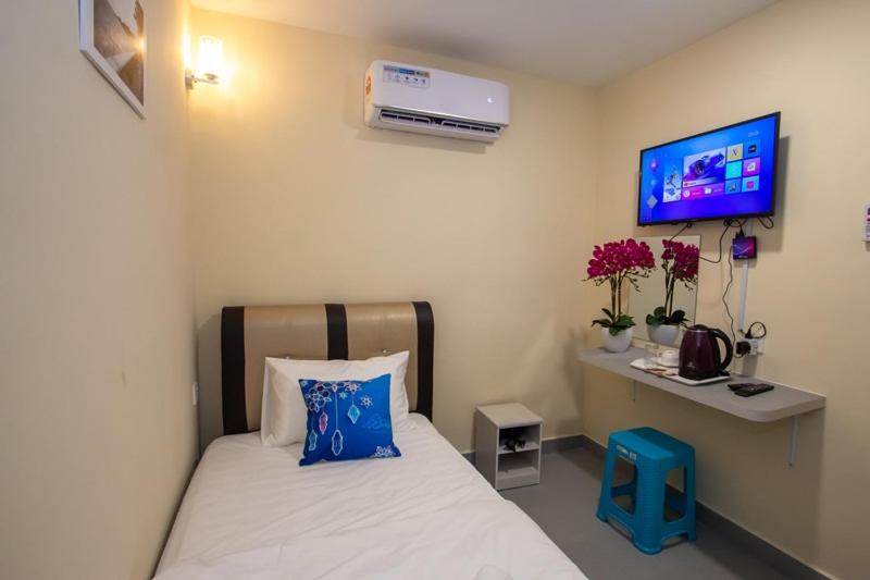 Postel nebo postele na pokoji v ubytování Southern Tip Hotel
