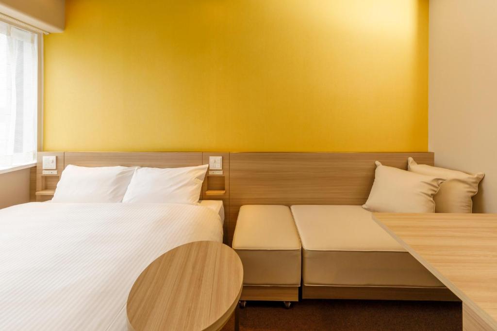 Postel nebo postele na pokoji v ubytování Via Inn Shimonoseki