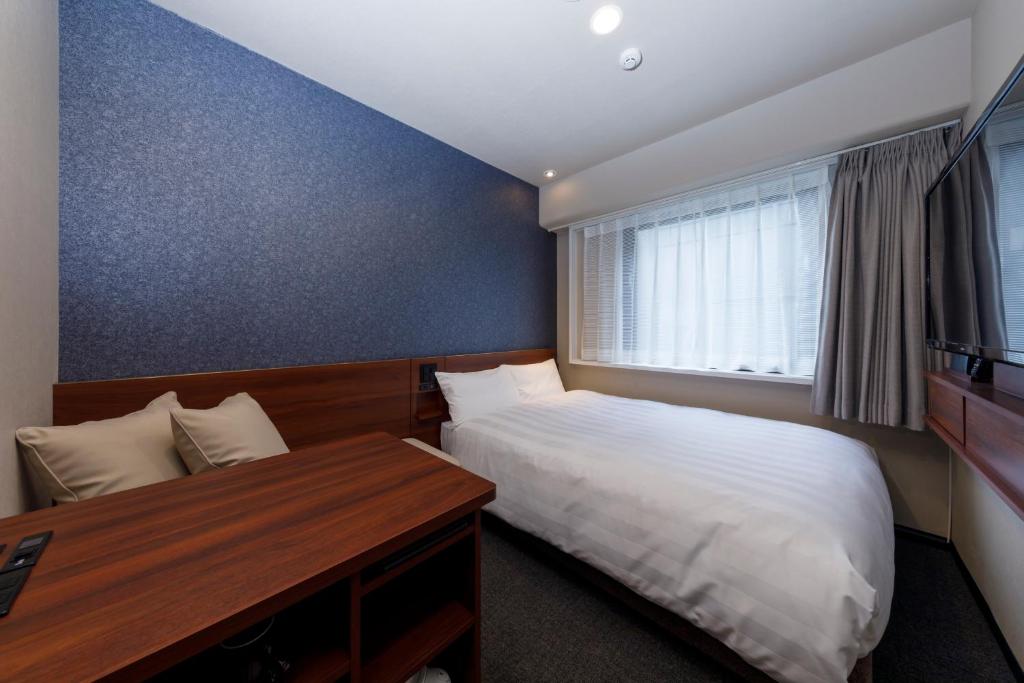 Postel nebo postele na pokoji v ubytování Via Inn Shimonoseki