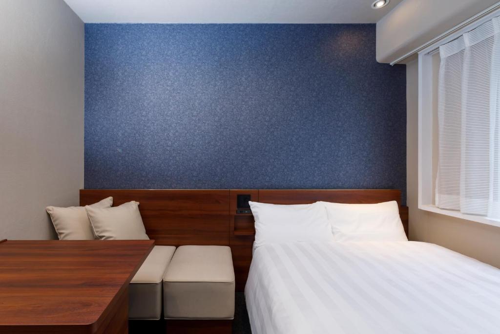 Postel nebo postele na pokoji v ubytování Via Inn Shimonoseki