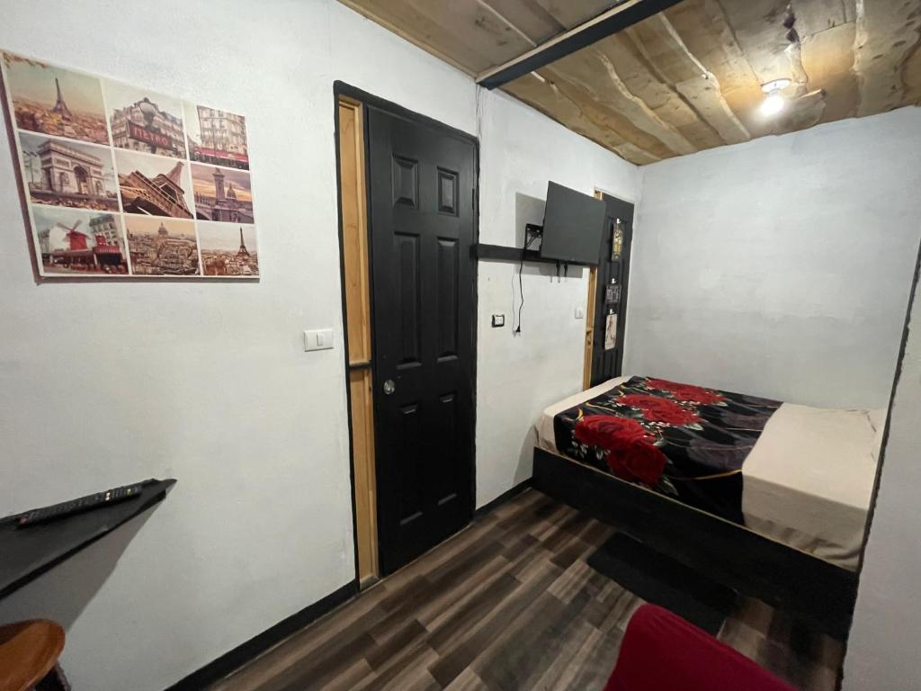 מיטה או מיטות בחדר ב-Poas Volcano Rooms