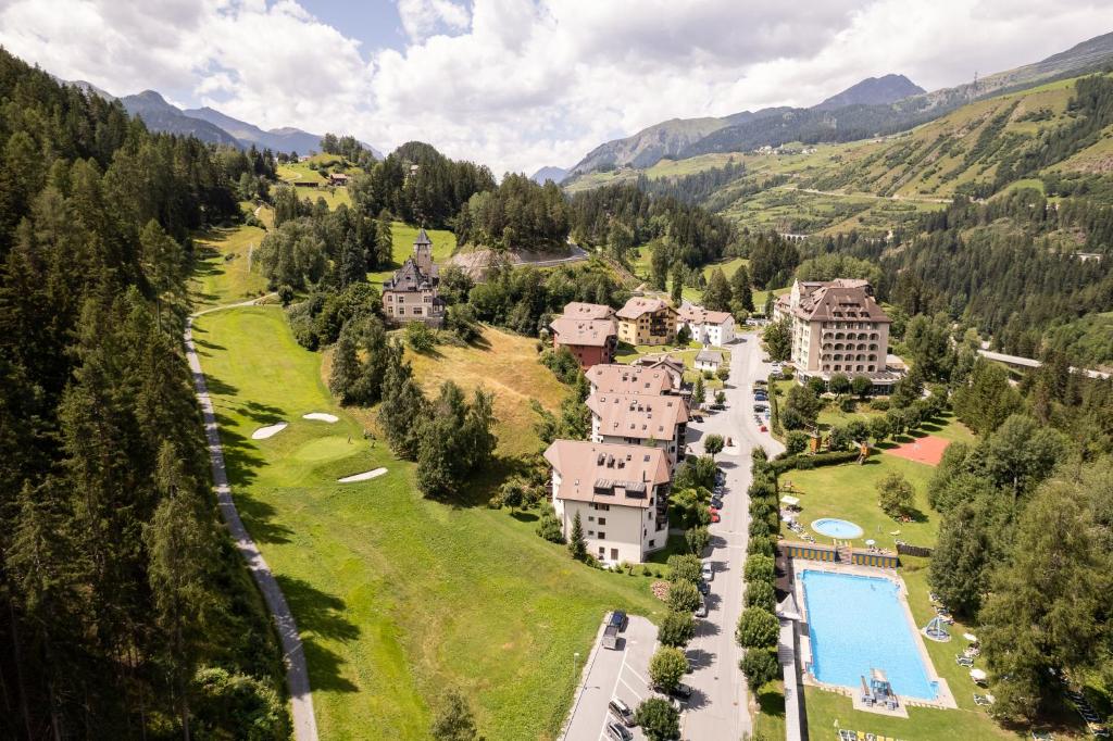 an aerial view of a resort with a pool at Chasa Valambrun 1004 in Vulpera