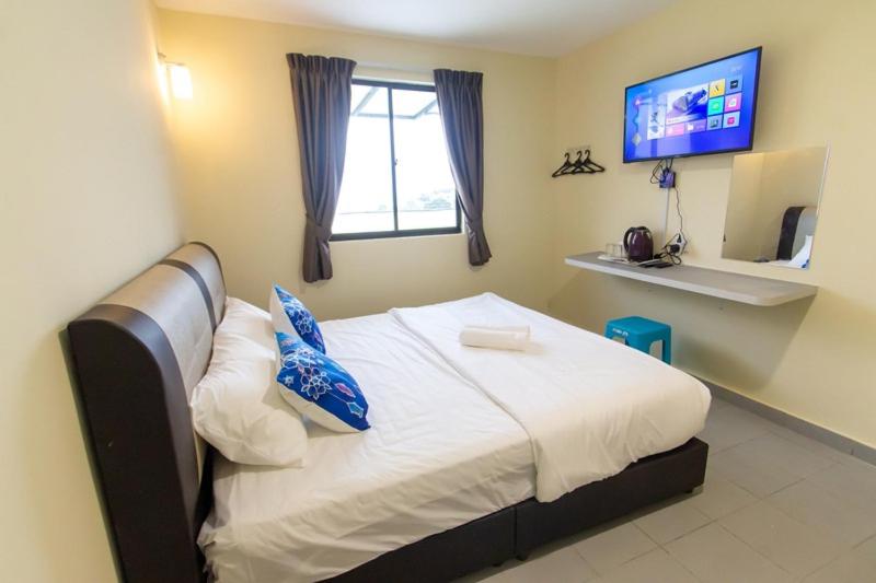 Postel nebo postele na pokoji v ubytování Southern Tip Hotel
