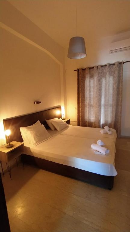 Postel nebo postele na pokoji v ubytování Perix House