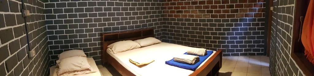 Cama ou camas em um quarto em Katumbiri Resort