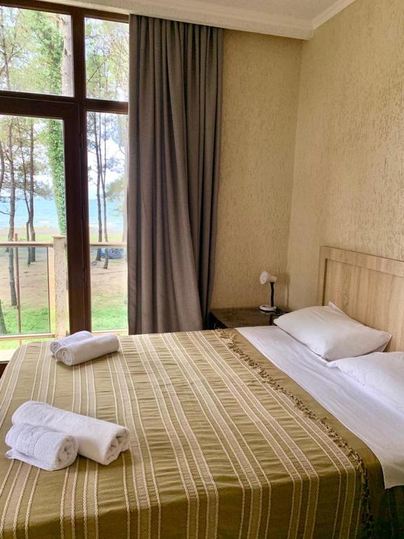 Postel nebo postele na pokoji v ubytování kaprovani Kako