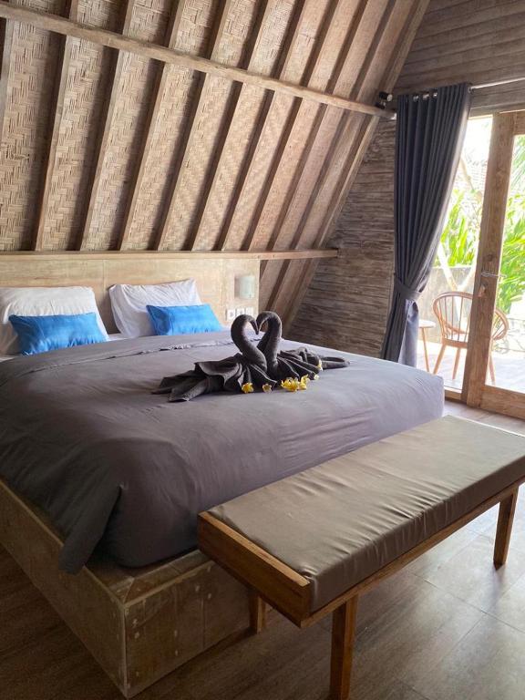 Postel nebo postele na pokoji v ubytování Kuri Garden Cottage