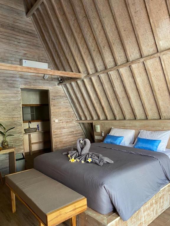 Postel nebo postele na pokoji v ubytování Kuri Garden Cottage