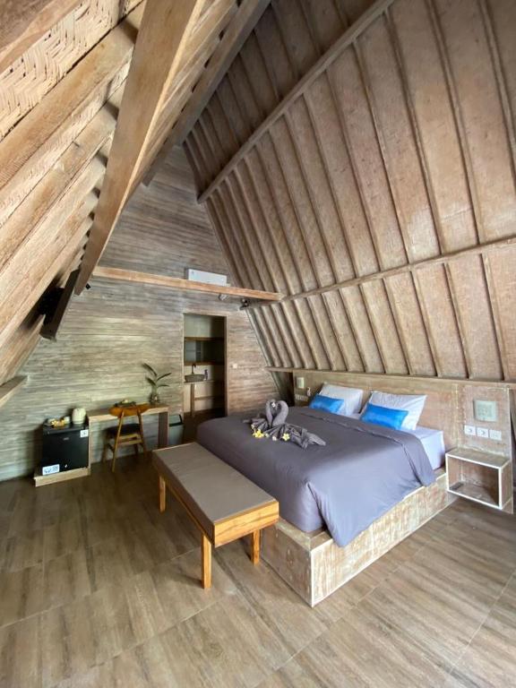Postel nebo postele na pokoji v ubytování Kuri Garden Cottage