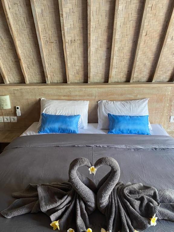 Postel nebo postele na pokoji v ubytování Kuri Garden Cottage