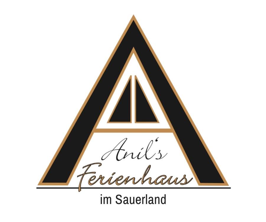 een driehoeklogo met de woorden Aid Federation in saaud bij Anil‘s Ferienhaus in Olsberg