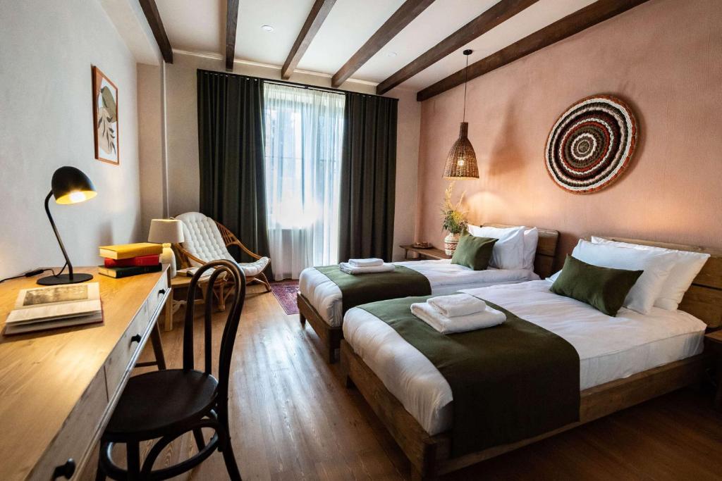 Postel nebo postele na pokoji v ubytování Hameau Mukhrani