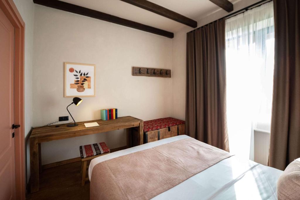 Postel nebo postele na pokoji v ubytování Hameau Mukhrani