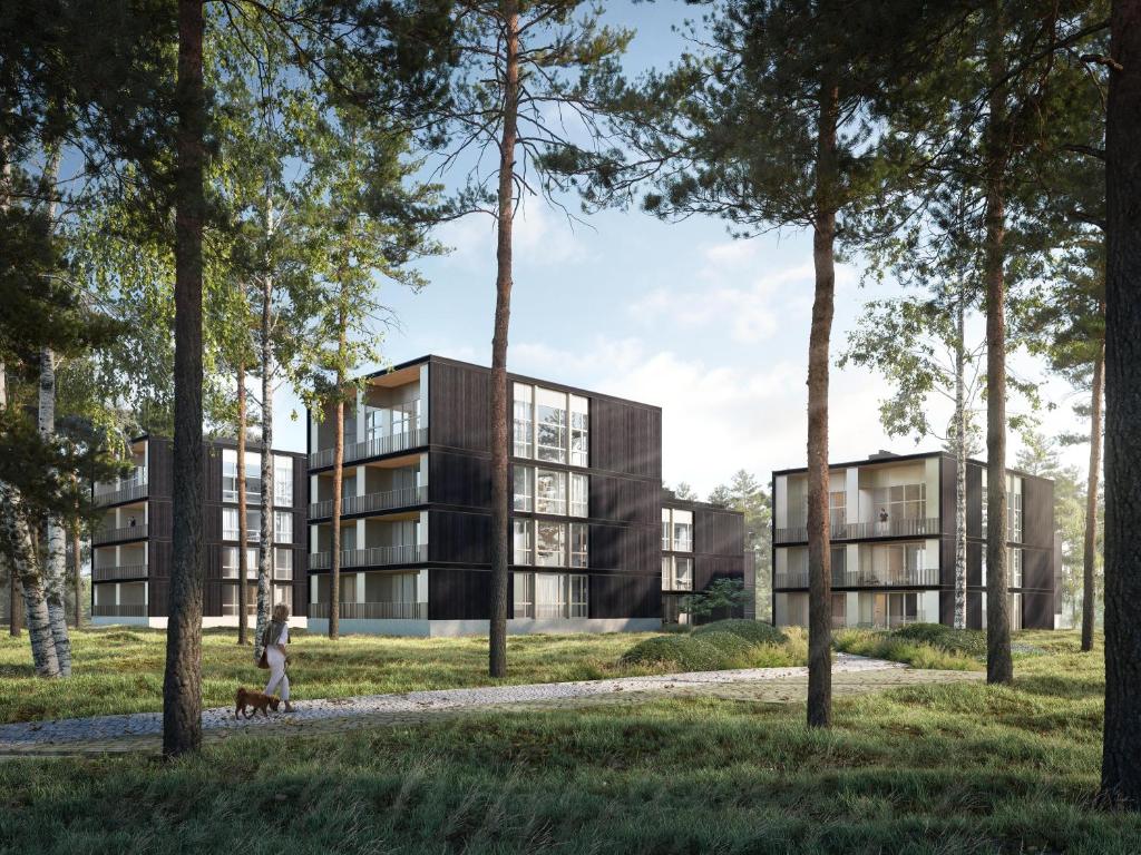ein Abbild eines Gebäudes in einem Park mit Bäumen in der Unterkunft My Marina Apartment mit Pool und Sauna am See in Bad Saarow